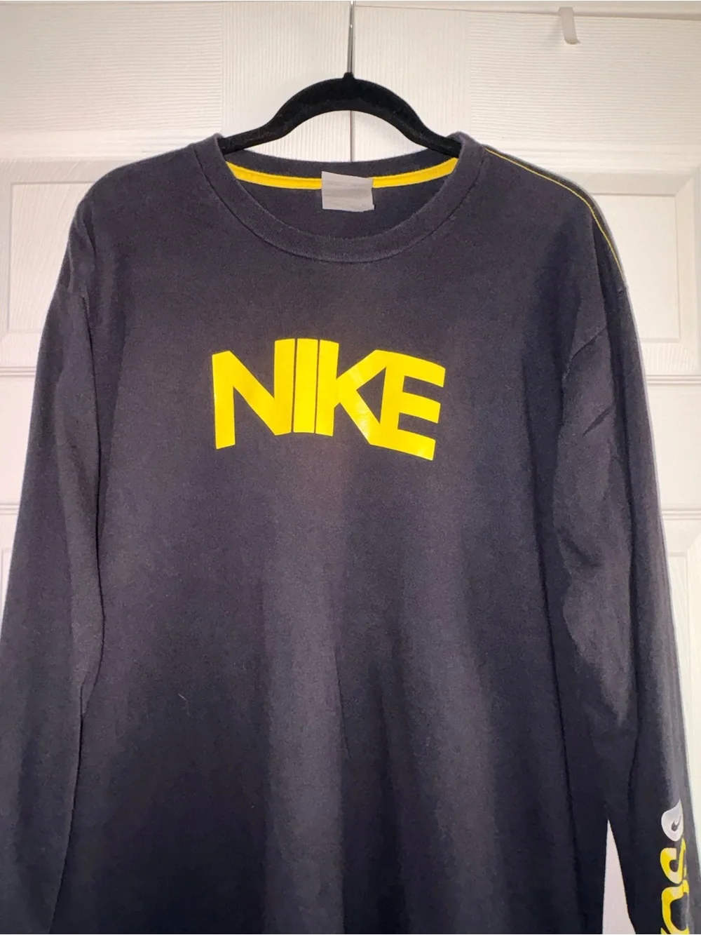 Nike Black Long-Sleeve Tee with Yellow Logo and Sleeve Text